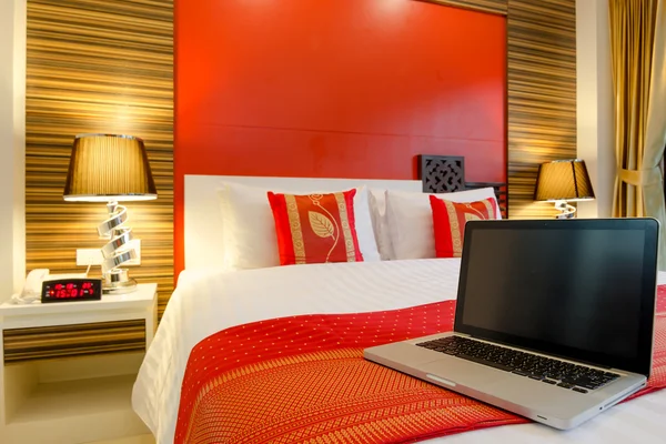 Laptop on the bed — Stock Photo, Image