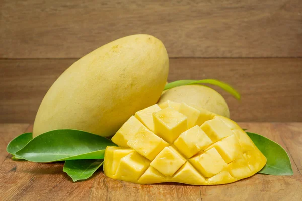 Mango on a dark wood background. — Stock Photo, Image