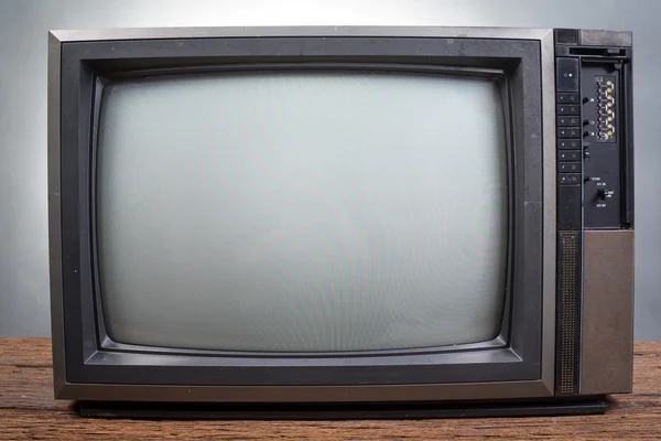 Vintage telewizji na stół z drewna — Zdjęcie stockowe