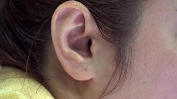 Close up of asian female ear . — Stock Video