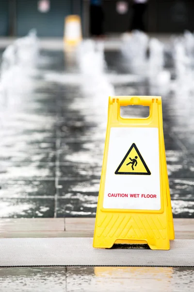 Sign showing warning of caution wet floor — Stock Photo, Image