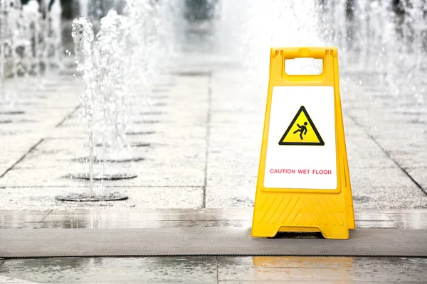 Sign showing warning of caution wet floor — Stock Photo, Image