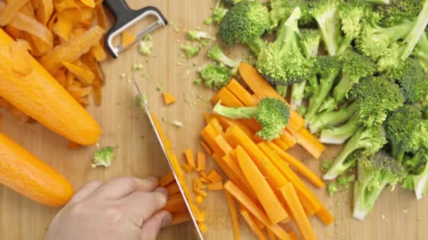 Man Hands Slice Carrot Chopping Board Framed Fresh Vegetables Table — Stock Video