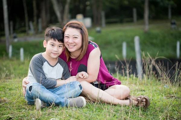 Son hugging mother Asian family — Stock Photo, Image