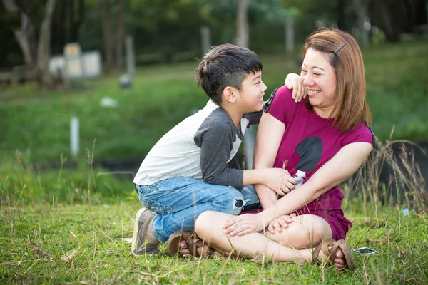 Beautiful asian woman with your son — Stock Photo, Image