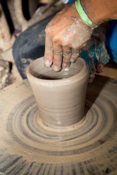 Close up photo of child hands in potter craft — Stock Photo, Image