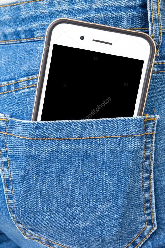 Cell phone in back pocket of girl's jeans — Stock Photo