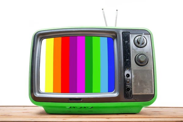 Grüner Vintage-Fernseher auf Holztisch — Stockfoto