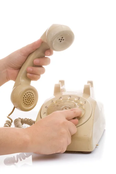 Hand halten vintage Telefon creme Farbe — Stockfoto