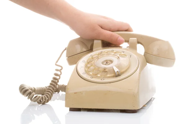 Hand halten vintage Telefon creme Farbe — Stockfoto