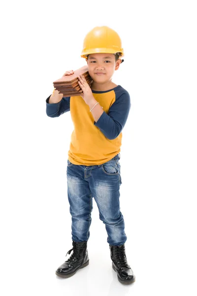 Joven asiático niño construcción trabajador holding equipo — Foto de Stock