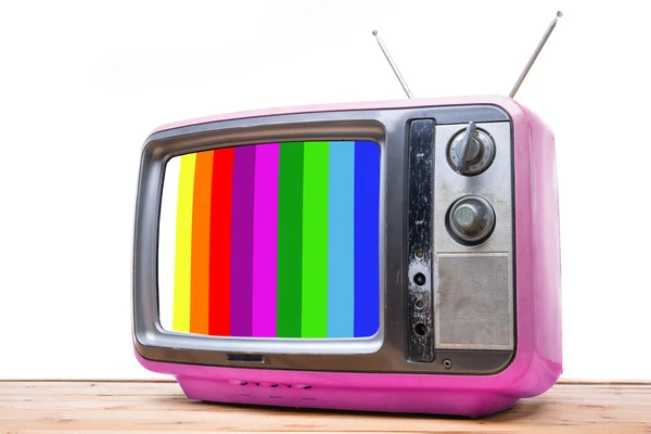 TV Vintage rosa na mesa de madeira — Fotografia de Stock