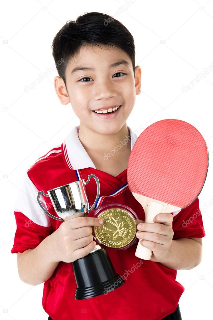 Portrait of Happy asian boy play table tennis 