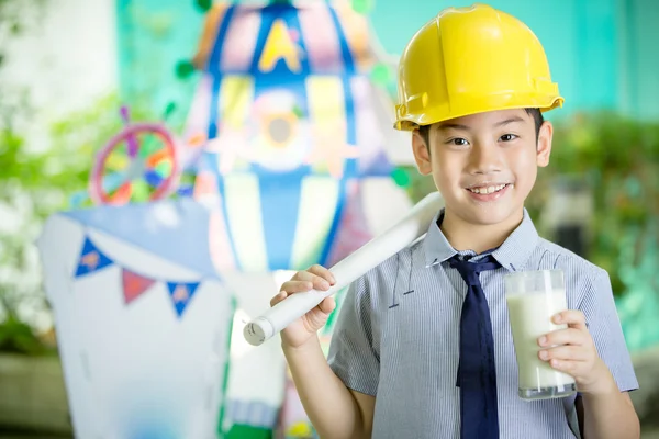 Young asian child holding a glass of milk — Stock Photo, Image