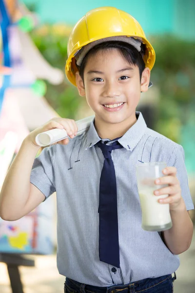 Young asian child holding a glass of milk — Stock Photo, Image