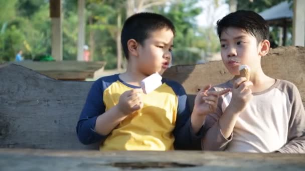 Little asian child enjoy eating ice cream together — Stock Video