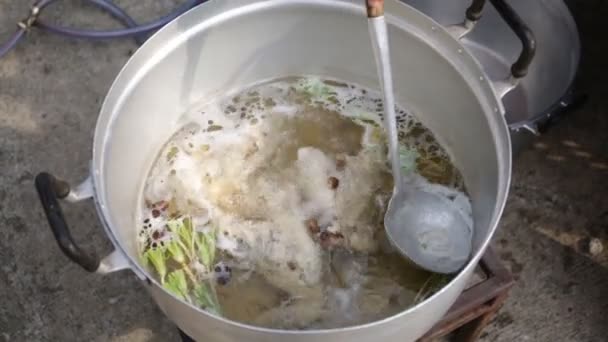 Chicken soup boiling in a kitchen pot . — Stock Video