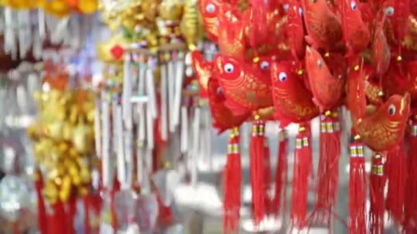 Orange Fish-shaped Mobile ornament in the market — Stock Video