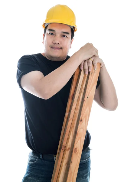 Portrait of asian smiling carpenter holding wood planks. — Stock Photo, Image