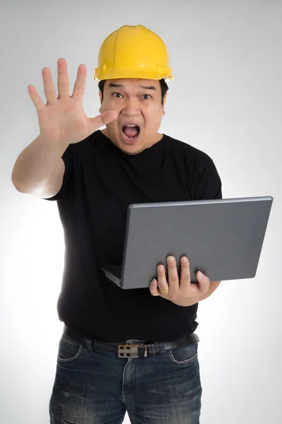 Engineer checking on production on laptop — Stock Photo, Image