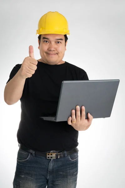 Engineer checking on production on laptop — Stock Photo, Image