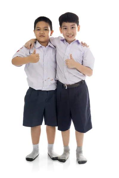 Asian primary school students back from school, shabbily — Stock Photo, Image