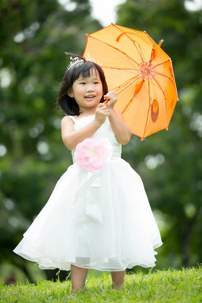 Portrait of asian girl in the park green background, — Stock Photo, Image