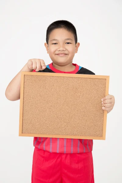 Little asian boy holding empty wood board in sport uniform — Stock Photo, Image