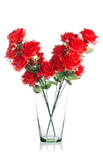 Ramo de rosas rojas de plástico en frasco de vidrio —  Fotos de Stock