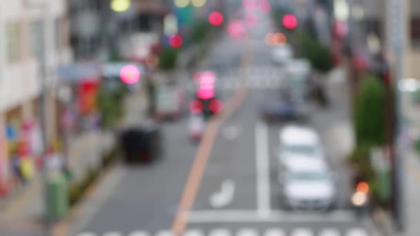 Фон з автомобілями. З фокус фону з розмито unfocused Місто вогнів. Токіо, Японія. — стокове відео