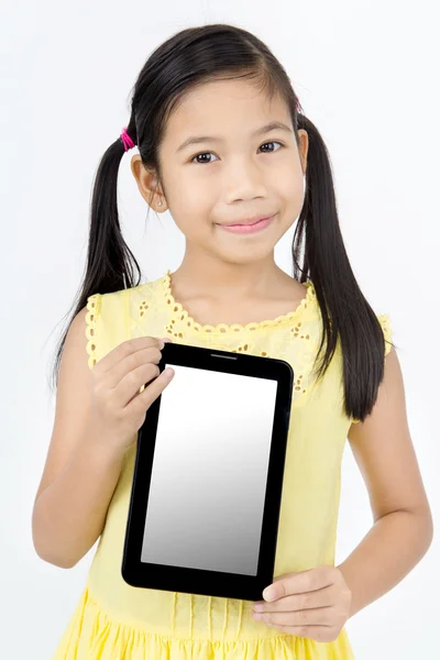 Little asian girl smiles with tablet computer — Stock Photo, Image