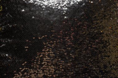 Altın pullu bir yastıktan yapılmış arka plan bronz beyaz ve kahverengi renkler