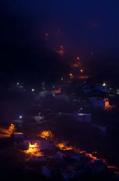 Village of El Juncal at night in the fog. — Stock Photo, Image
