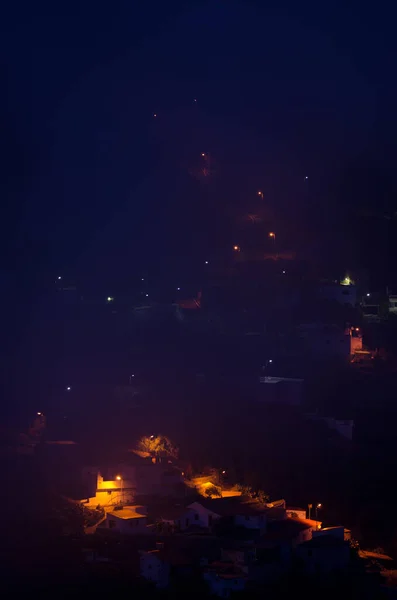 Village of El Juncal at night in the fog. — Stock Photo, Image
