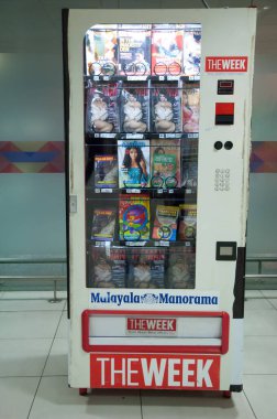 Magazines vending machine in the Indira Gandhi International Airport. clipart