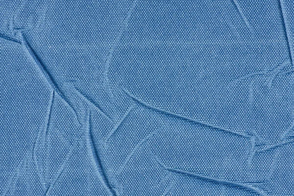 背景または折り畳まれた青い布のクローズ アップのテクスチャ — ストック写真