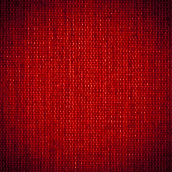 Bakgrundsstruktur av mörkt rött tyg närbild med vinjett — Stockfoto