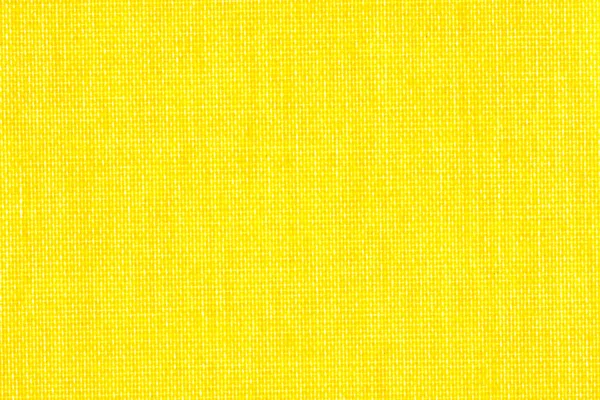 Bakgrundsstruktur av ljusa gula tyg närbild — Stockfoto