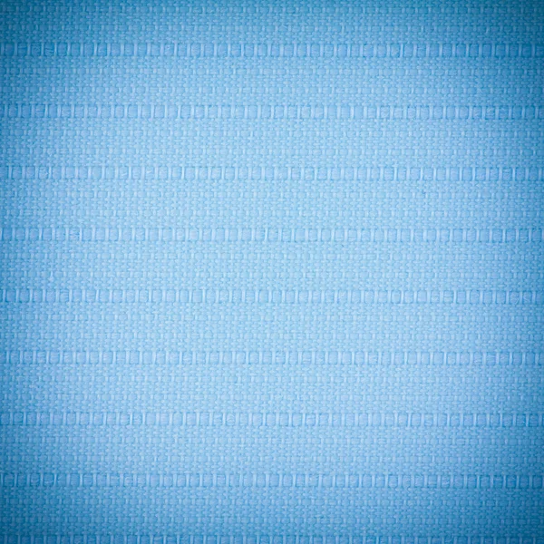 Achtergrond textuur van blauwe stof close-up met vignet — Stockfoto