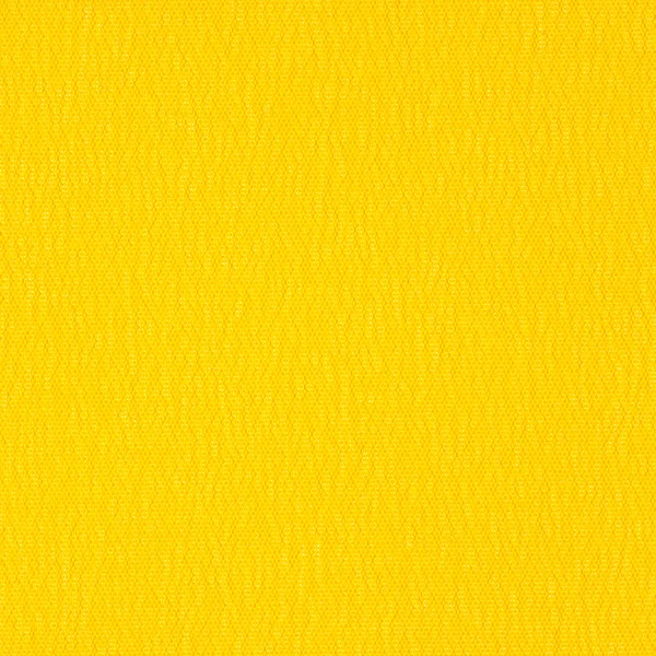 Текстура тла яскраво-жовтого тканини крупним планом — стокове фото