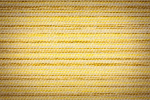 Tekstura tło zbliżenie żółty tkaniny z winiety — Zdjęcie stockowe