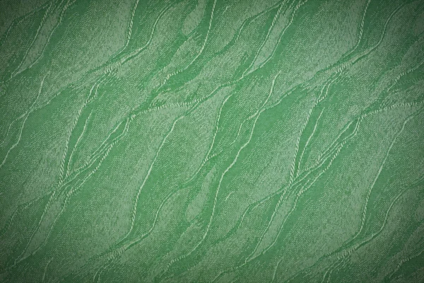 Achtergrond textuur van groene weefsel close-up met vignet — Stockfoto