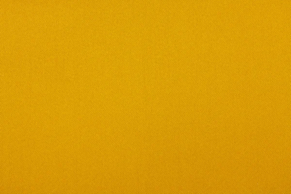Bakgrundsstruktur av gult tyg närbild — Stockfoto