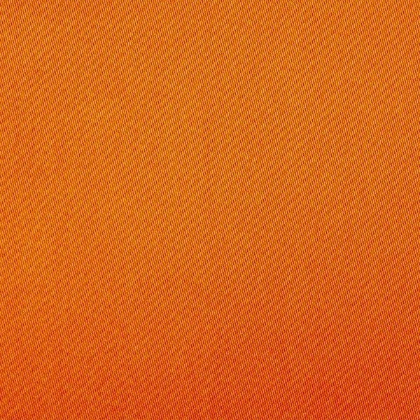 Bakgrundsstruktur av orange tyg närbild — Stockfoto