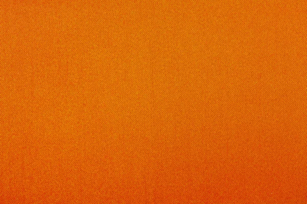 Tekstura tło zbliżenie pomarańczowym tkaniny — Zdjęcie stockowe