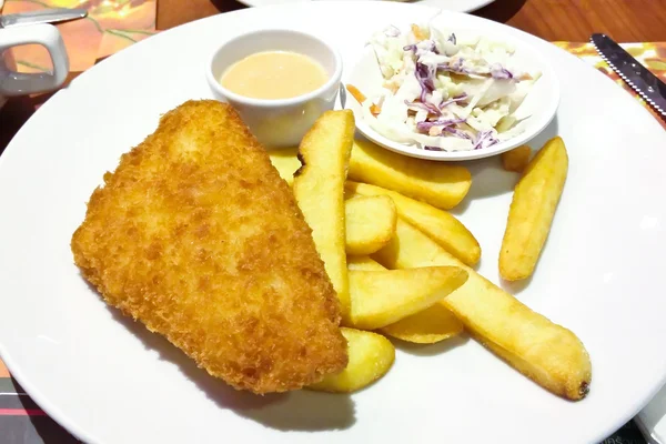 Fried fish served with French fries — Stock Photo, Image