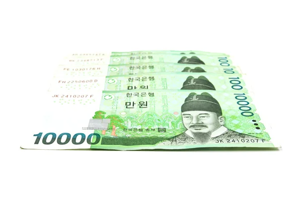 Корейські банкноти, виділені на білому тлі. — стокове фото