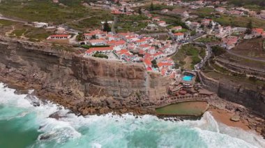 Discover and explore the breathtaking coastal views that Azenhas Do Mar Beach in Sintra, Portugal has to offer, showcasing the incredible beauty of nature and its stunning scenic coastal landscapes