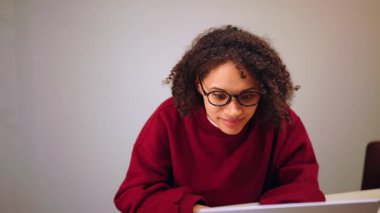 Creative professional using laptop and notebook at desk, startup planning, remote collaboration, innovation, productivity and contemporary business lifestyle.