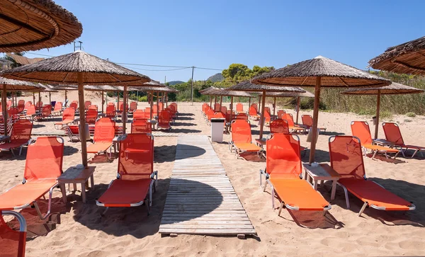 Sunbeds on Banana beach, Zakynthos, Greece — Stock Photo, Image